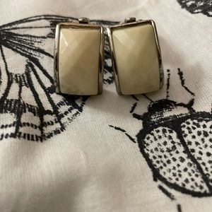 These are silver vintage cream clip on earrings.